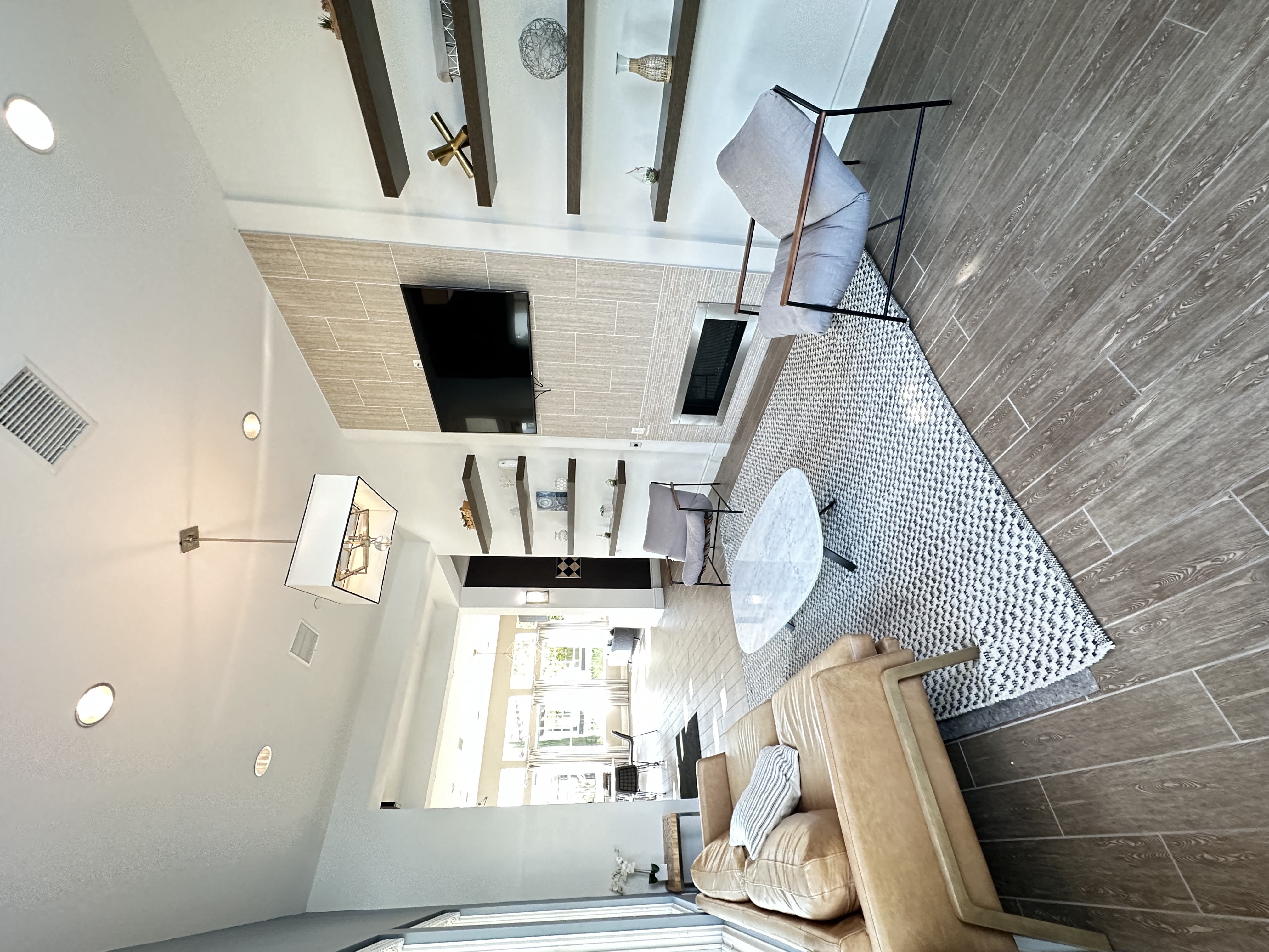 a club room with a couch and a tv in a loft at The Bryant Apartments at Yorba Linda, Yorba Linda, 92887