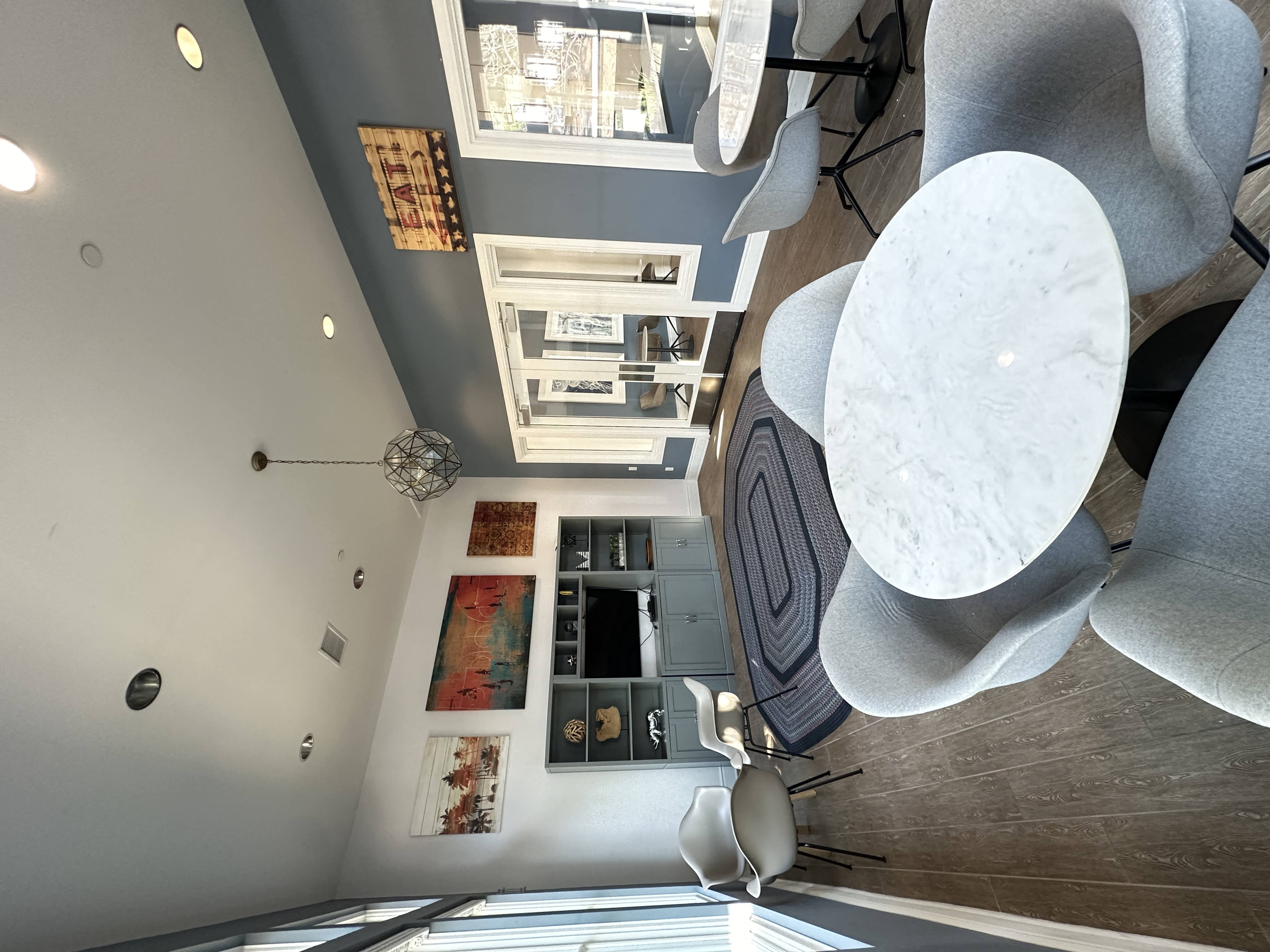 a view from the top down of a living room with a table and chairs at The Bryant Apartments at Yorba Linda, Yorba Linda, CA 92887