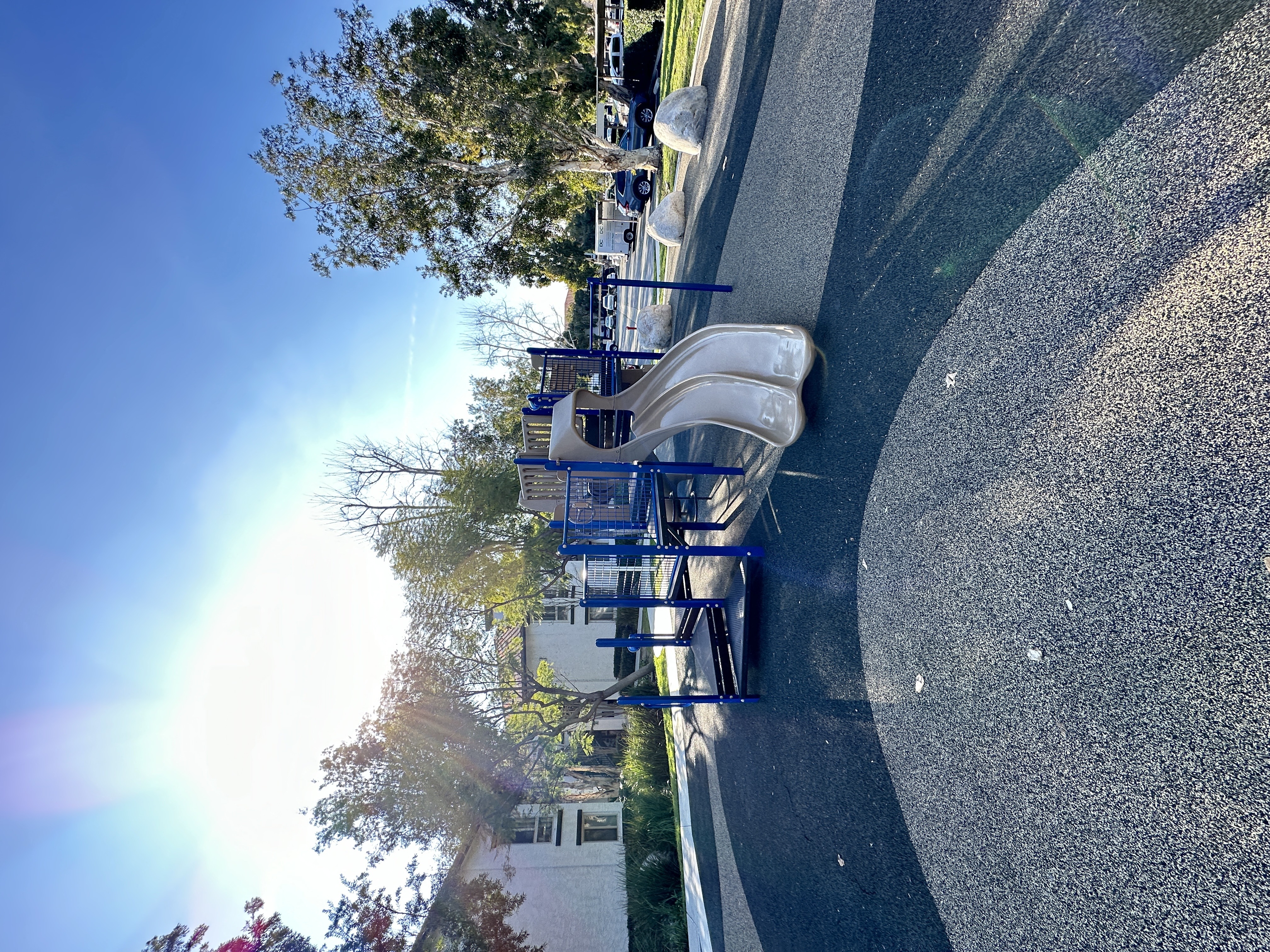 a park with multiple slides at The Bryant Apartments at Yorba Linda, California