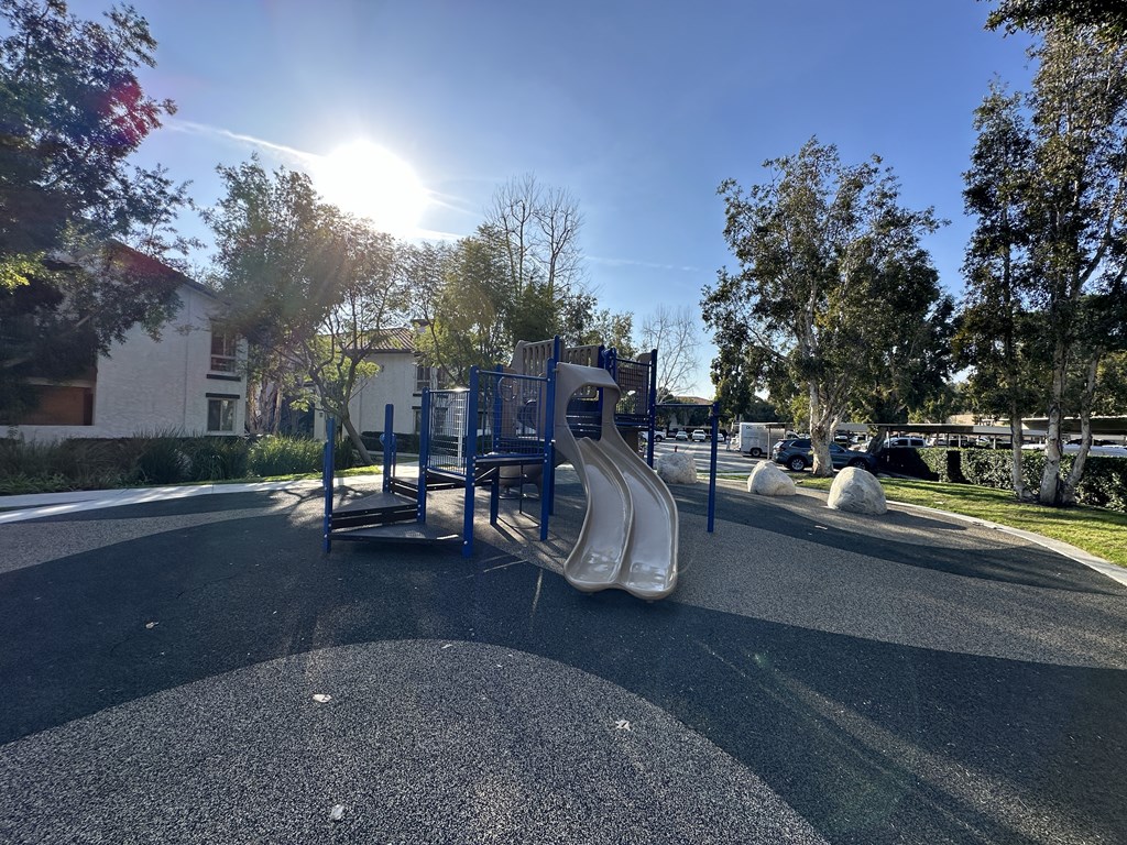 a playground with a slide in a park at The Bryant, Yorba Linda, CA 92887