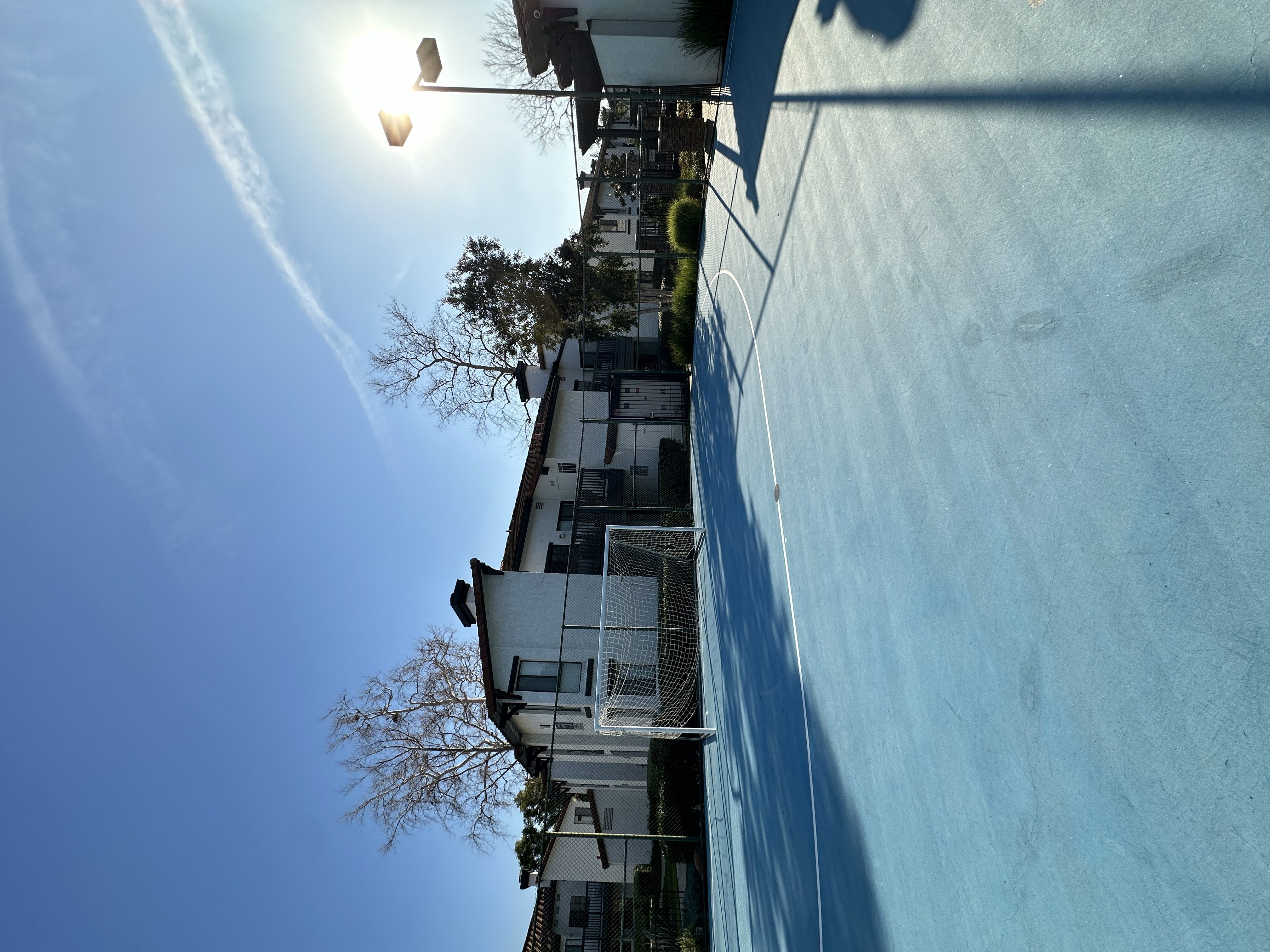 a view of the side of a building and sports court