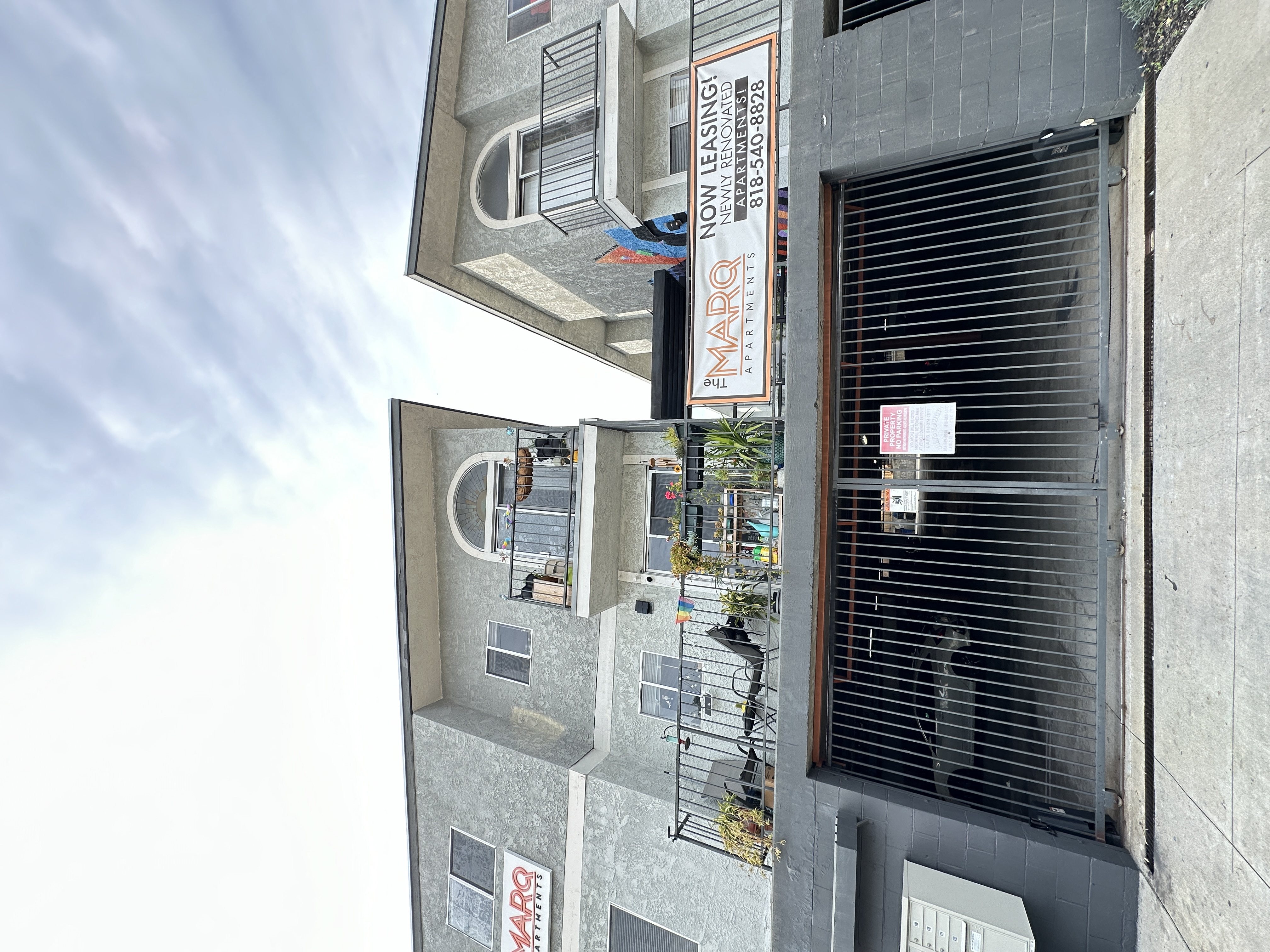 the side of a building with a window and a door