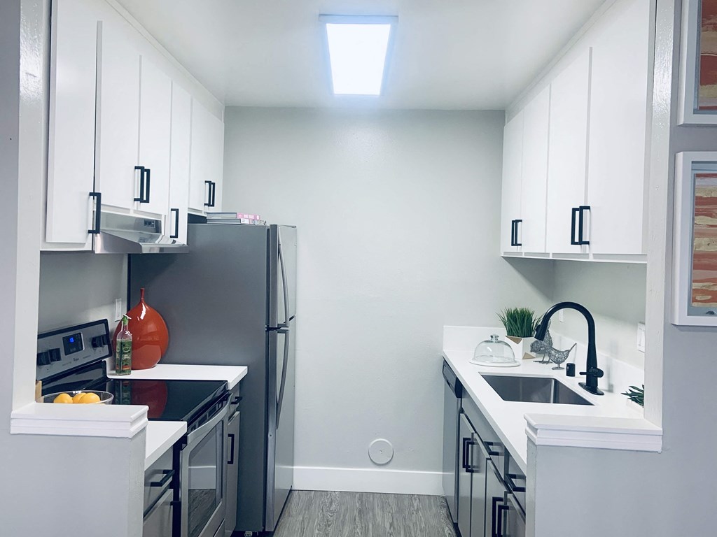 Kitchen with white cabinets at Parc Medallion Apartments, Union City, 94587