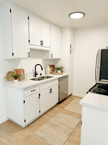 kitchen with white cabinets at Latitude Apartments at Mission Valley, San Diego California