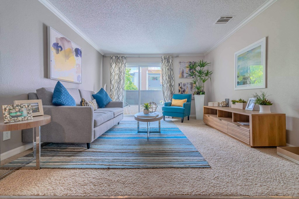 a living room with a couch and a table at City View Apartments at Warner Center, Woodland Hills, CA 91367