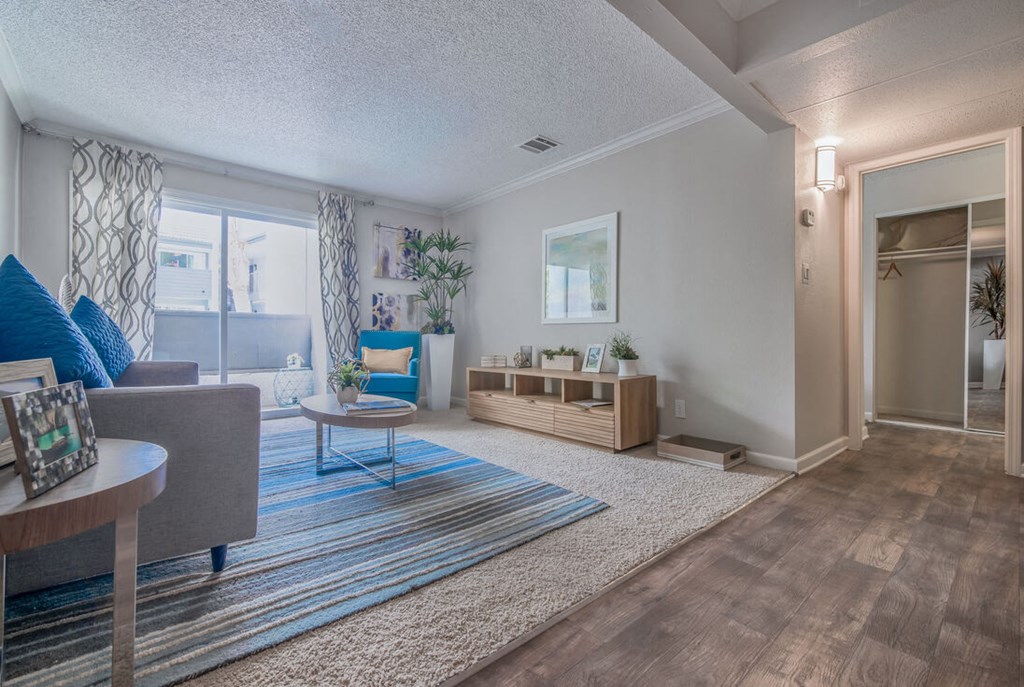 a living room with a geometric design on the wall at City View Apartments at Warner Center, Woodland Hills, 91367