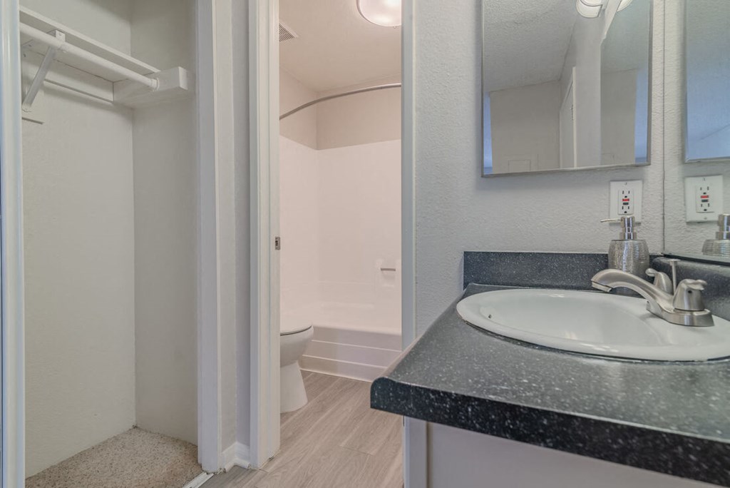 a bathroom with a sink and a toilet at City View Apartments at Warner Center, Woodland Hills, CA 91367