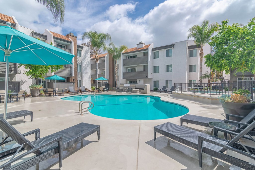 our apartments have a large swimming pool and lounge areas with umbrellas our apartments have a large swimming pool and lounge areas with umbrellas at City View Apartments at Warner Center, Woodland Hills, CA