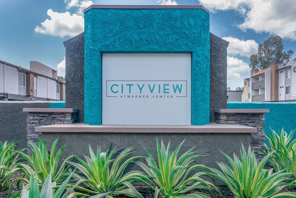 a rendering of the city view experience center with a sign on the front at City View Apartments at Warner Center, Woodland Hills California