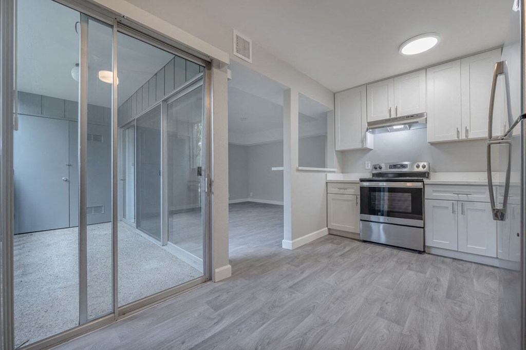 a renovated kitchen with white cabinets and stainless steel appliances  at Danville Park, Danville