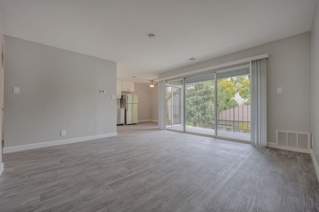 an empty living room with sliding glass doors to a balcony at Danville Park, Danville, CA