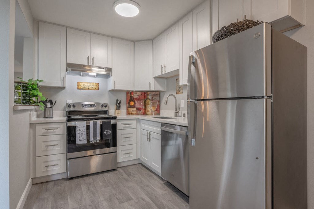 a modern kitchen with stainless steel appliances and white cabinets  at Danville Park, California, 94526