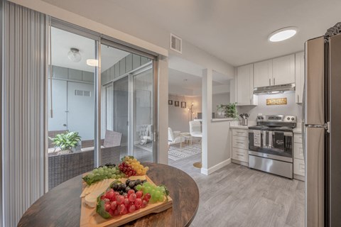a kitchen with a table with fruit on it
