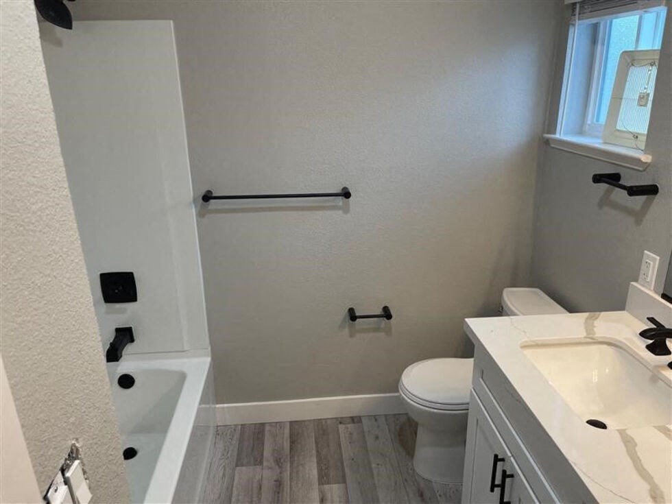 a bathroom with a toilet and a sink at Danville Park, Danville, CA