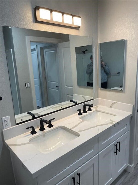 a bathroom with two sinks and a large mirror at Danville Park, Danville, CA, 94526