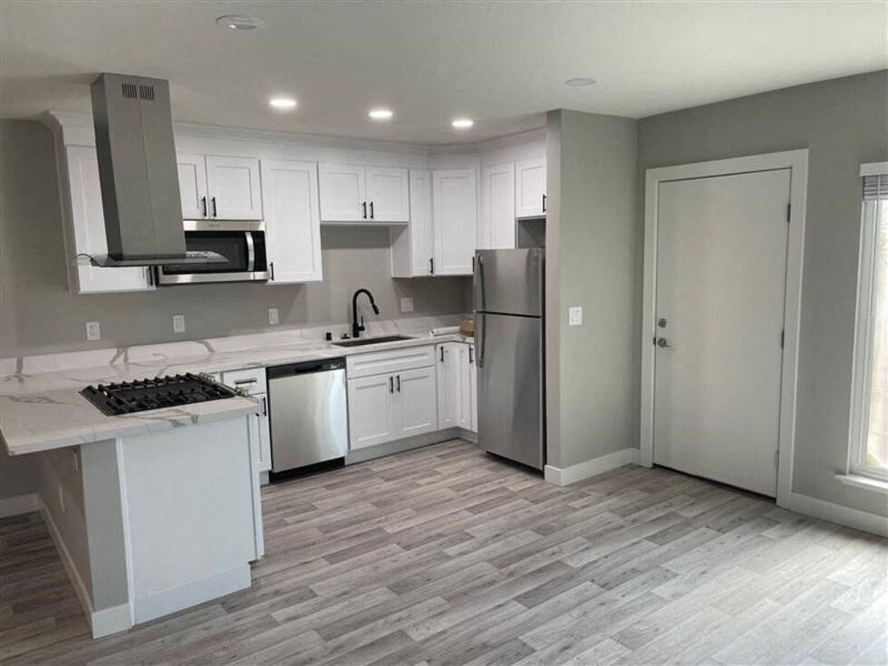 an empty kitchen with white cabinets and counter tops at Danville Park, California, 94526