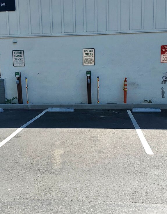 a blue building with parking meters in a parking lot at Danville Park, Danville, CA