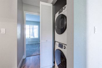 a washer and dryer in a laundry room with a window at Diablo Vista, Livermore, CA, 94551