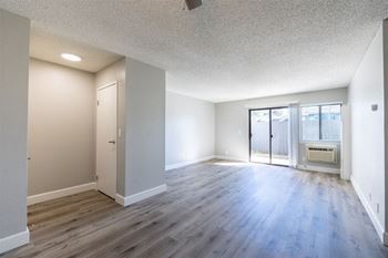 an empty living room with wood flooring and a door to a balcony at Diablo Vista, Livermore, CA, 94551