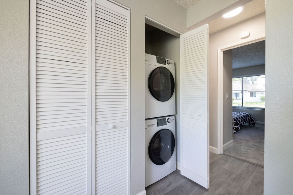 a laundry room with a washer and dryer in a closet
