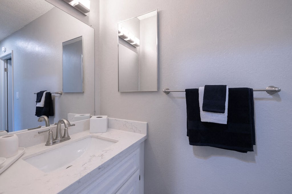 a bathroom with a sink and a mirror and a towel rack at Diablo Vista, California, 94551