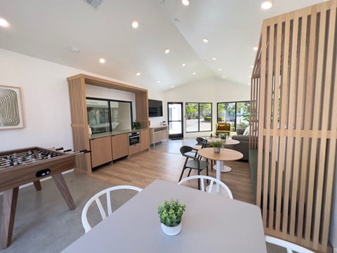 a kitchen and dining room with a table and chairs