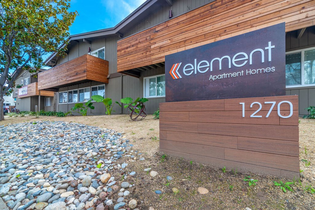 the front of an apartment building with a sign for lenient apartment homes at Element LLC, Sunnyvale, 94086