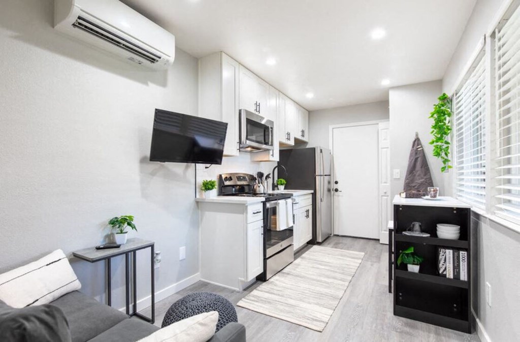 a living room with a kitchen and a couch at Element LLC, Sunnyvale, CA
