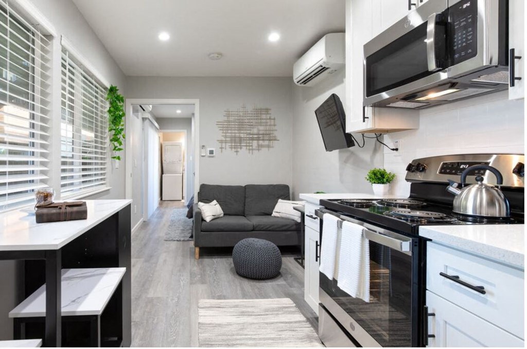 a small living room with a kitchen and a couch at Element LLC, Sunnyvale, 94086