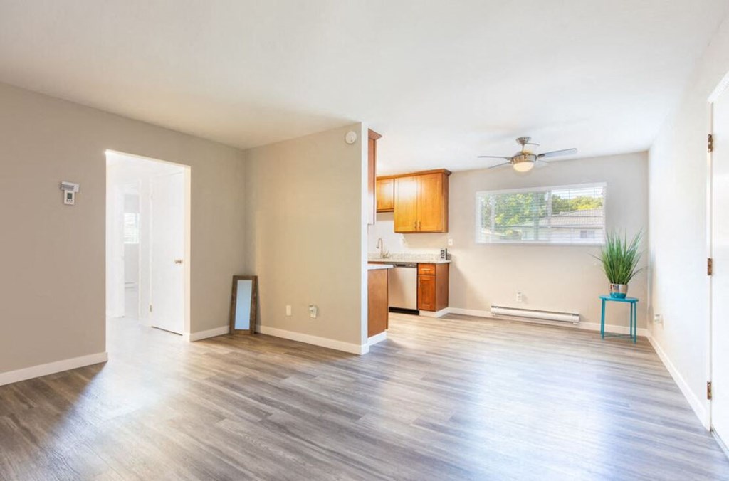an empty living room and kitchen with a wood floor at Element LLC, Sunnyvale, CA, 94086