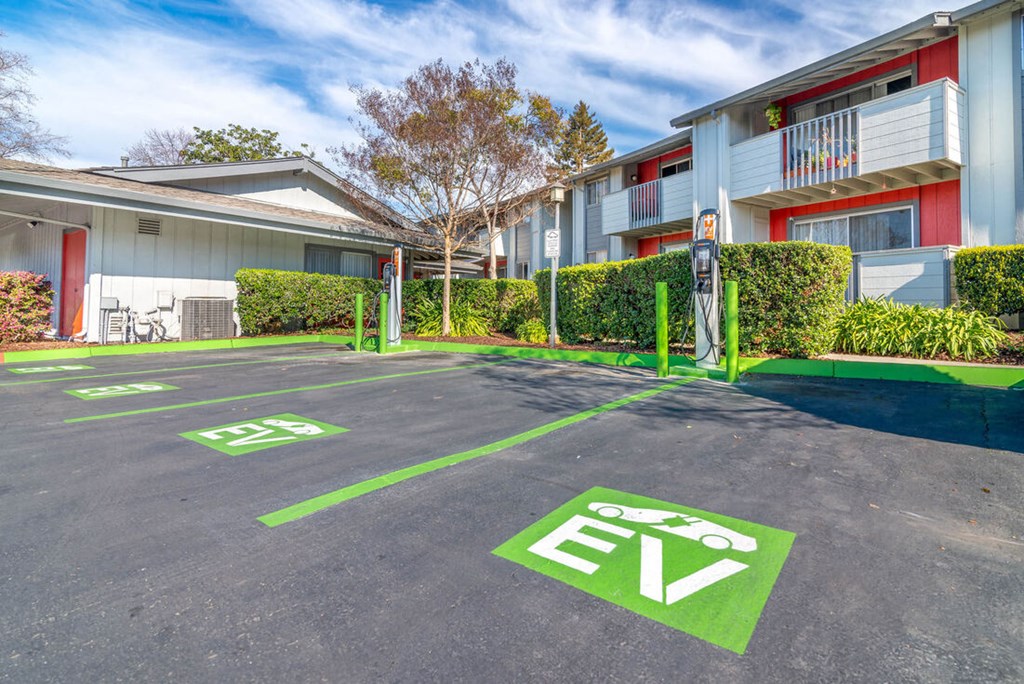 Parking lot in front of an apartment building at Sunnyvale Crossings Apartments, Sunnyvale, CA