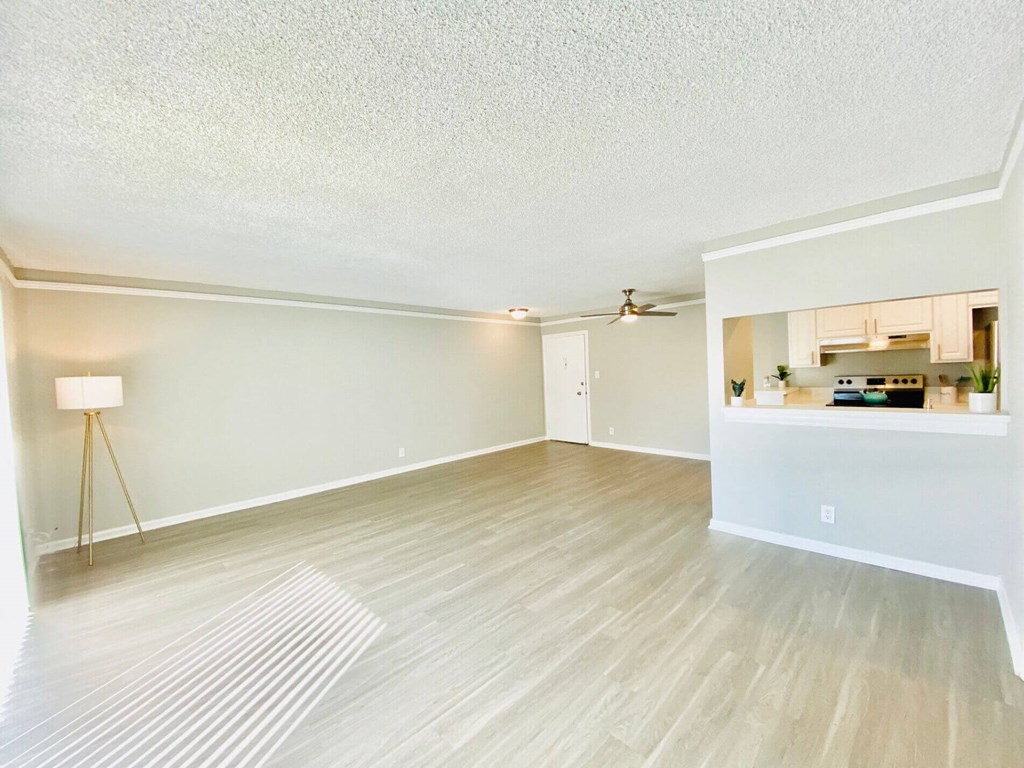 the spacious living room and kitchen of an apartment at The Flats on Addison, Sherman Oaks, CA