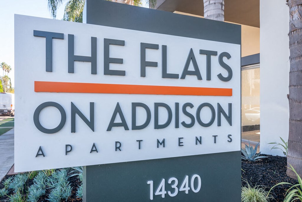 a sign that says the flats on admission apartments at The Flats on Addison, Sherman Oaks