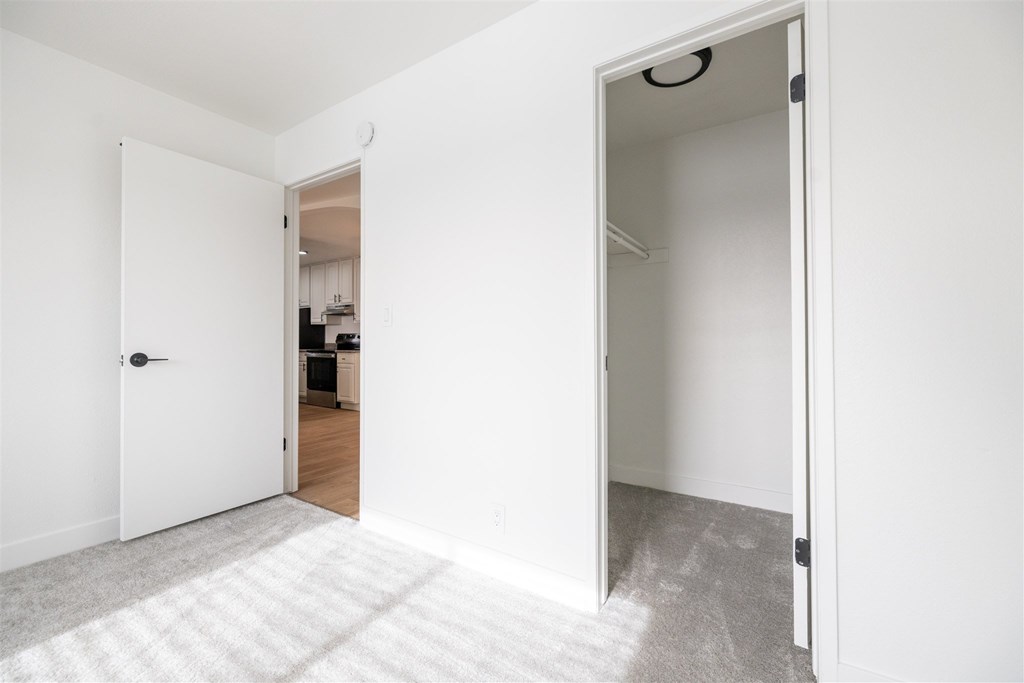 Bedroom With Closetat Summerhill Place Apartments, California