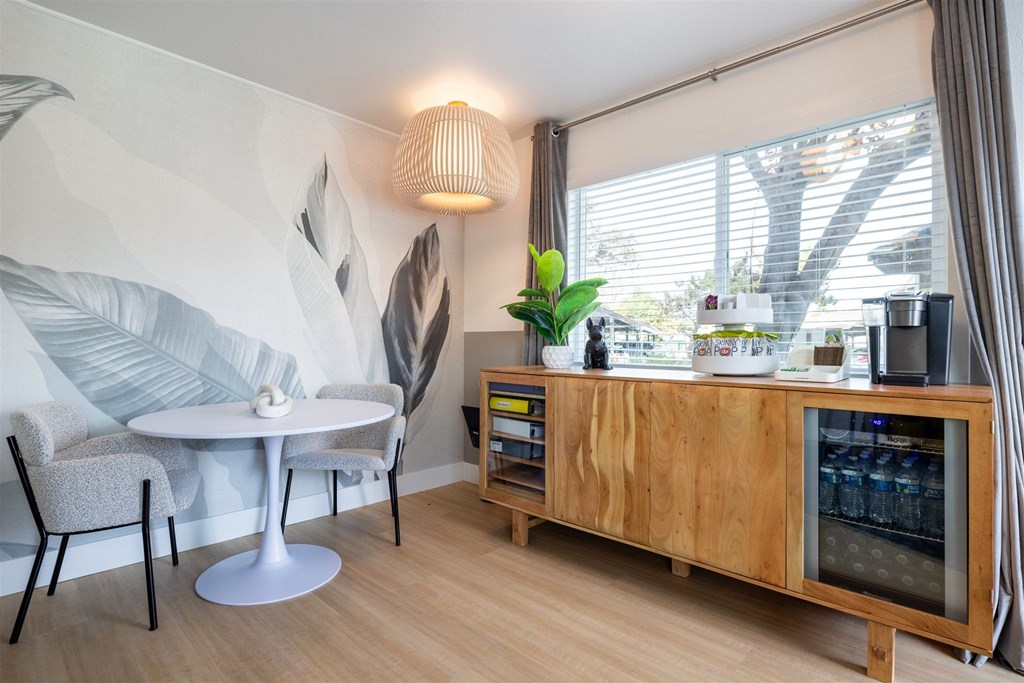 A modern dining area with a round table and chairs.