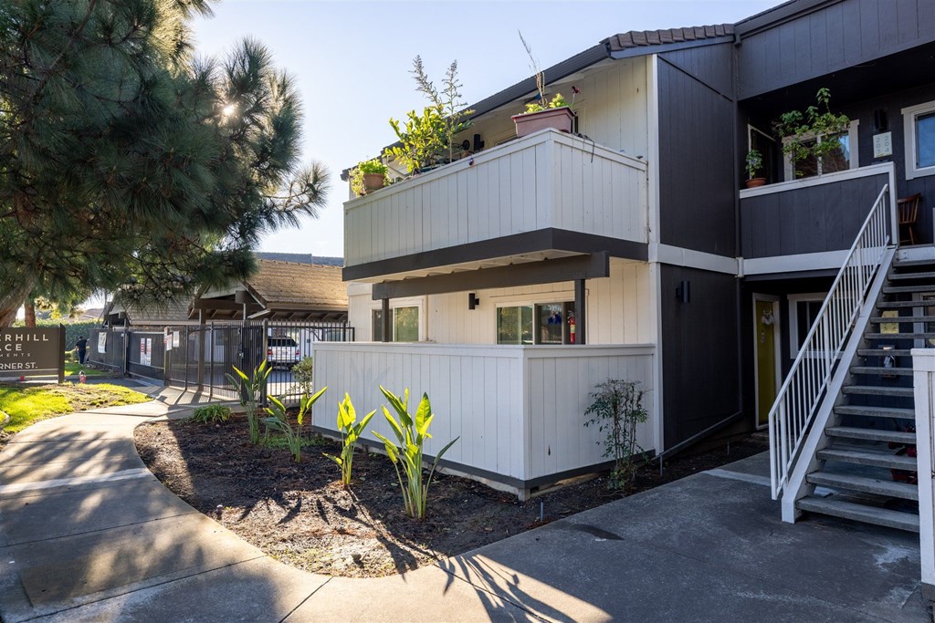 A modern two-story house with a balcony on the second floor.at Summerhill Place Apartments, Union City California