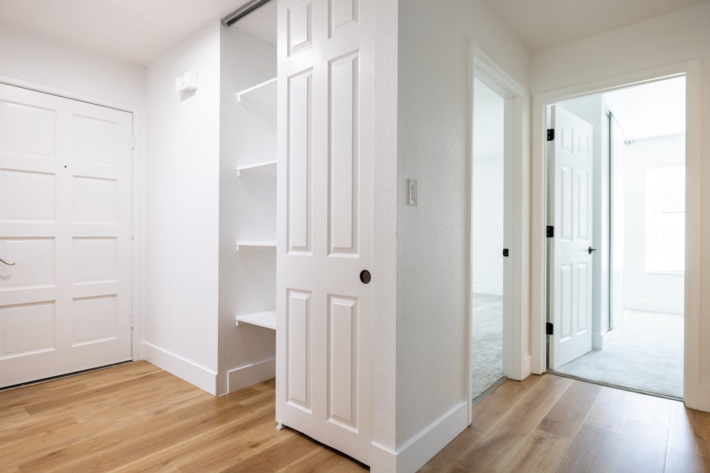 A white door with a shelf underneath it at Summerwood Apartment, Santa Clara, CA, 95050