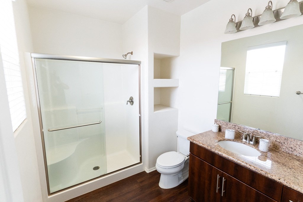 a bathroom with a shower and a sink and a toiletat The Vines at Riverpark, LLC, California, 93036