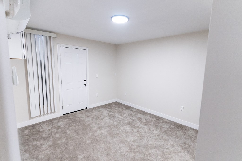 an empty room with white walls and a white door at The Flats on Addison, Sherman Oaks, CA 91423