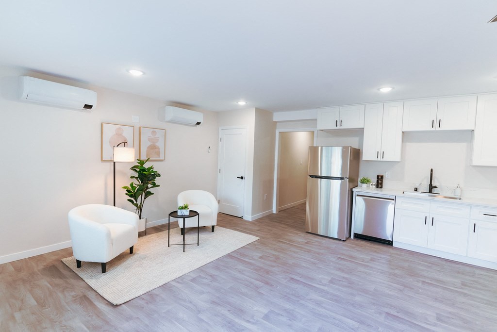  living room with white cabinets and a kitchen at The Flats on Addison, Sherman Oaks, 91423