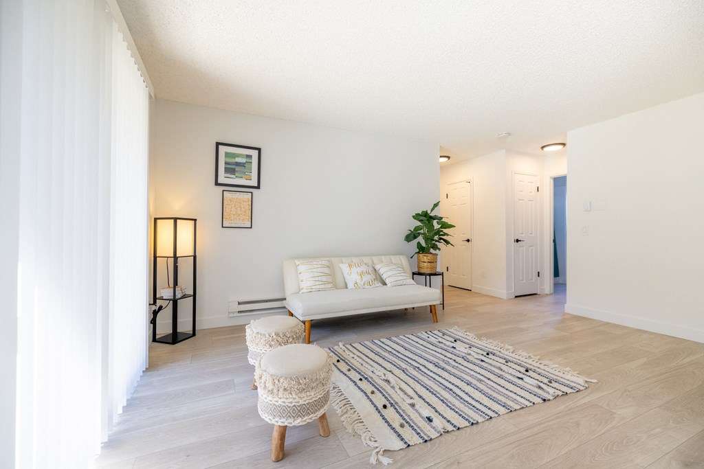 a living room with a couch and a rug at Campbell West Apartments, Campbell, California