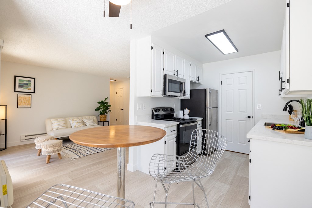 a living room with a kitchen and a dining table at Campbell West Apartments, Campbell, 95008