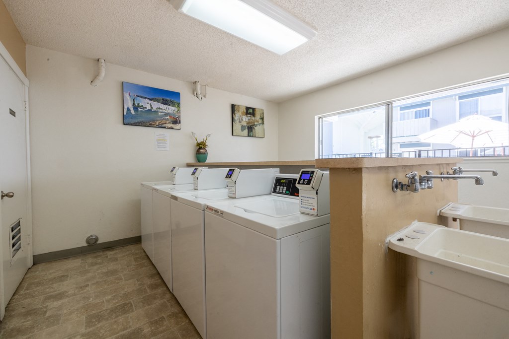 laundry room with washer and dryer and sink at the preserve apartments at Campbell West Apartments, Campbell, CA 95008