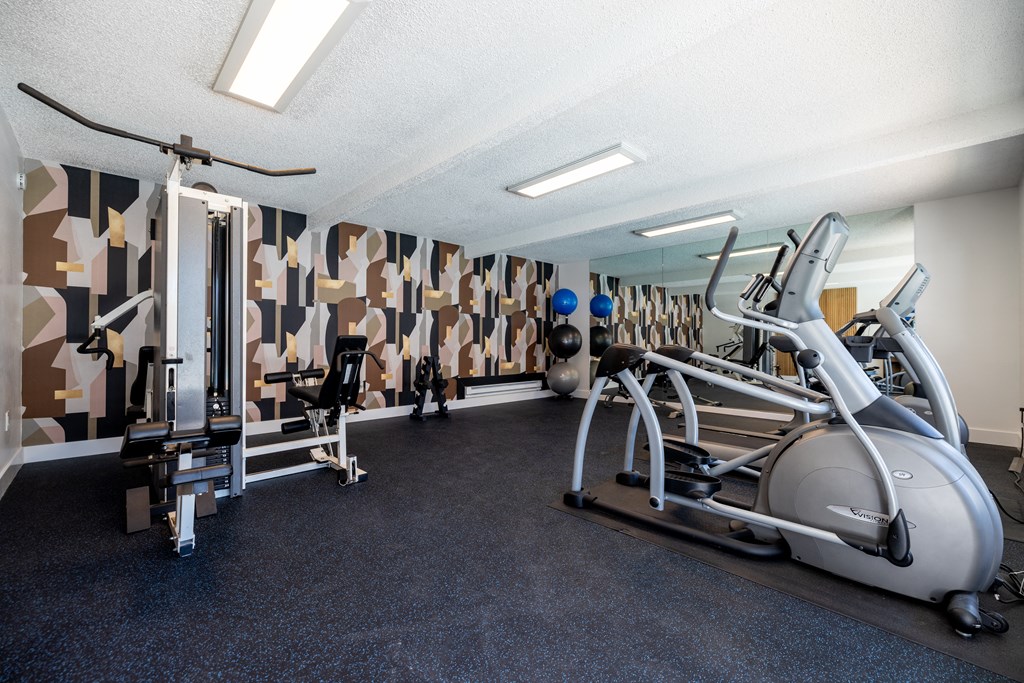 a gym with treadmills and other exercise equipment at Campbell West Apartments, Campbell