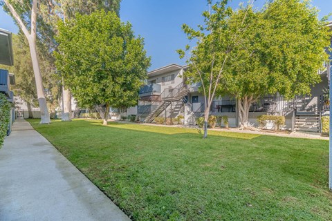 apartment community with grass and trees at BLVD Apartments LLC, Tarzana, CA 91356