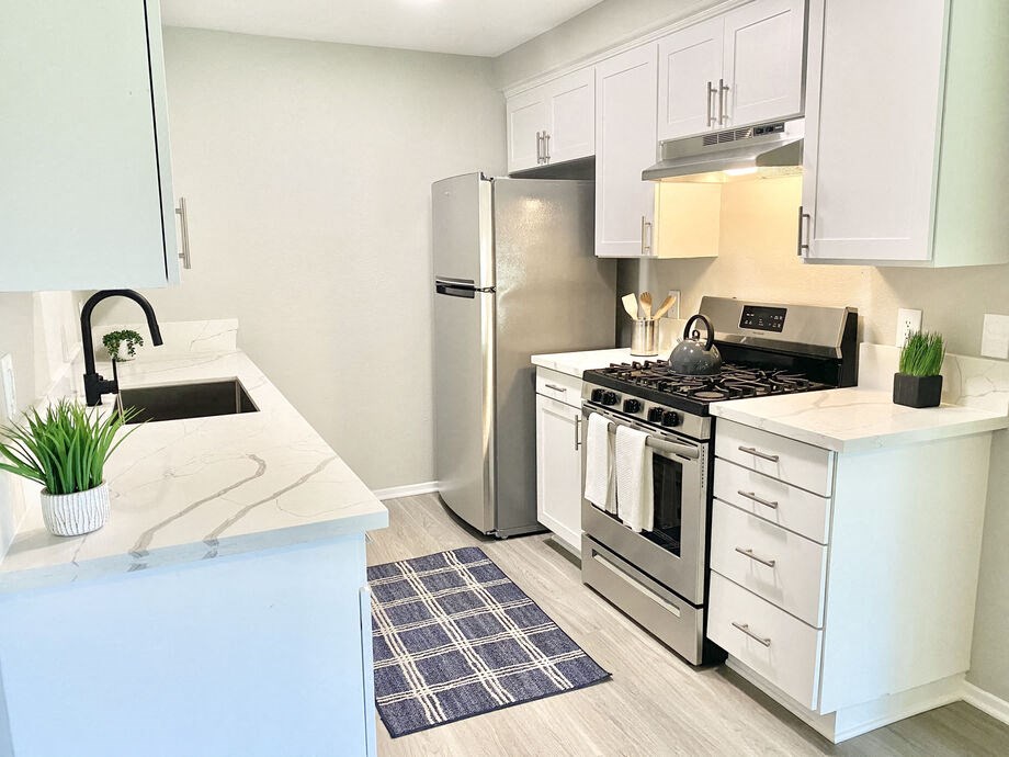 a kitchen with stainless steel appliances and a counter top at BLVD Apartments LLC, California, 91356