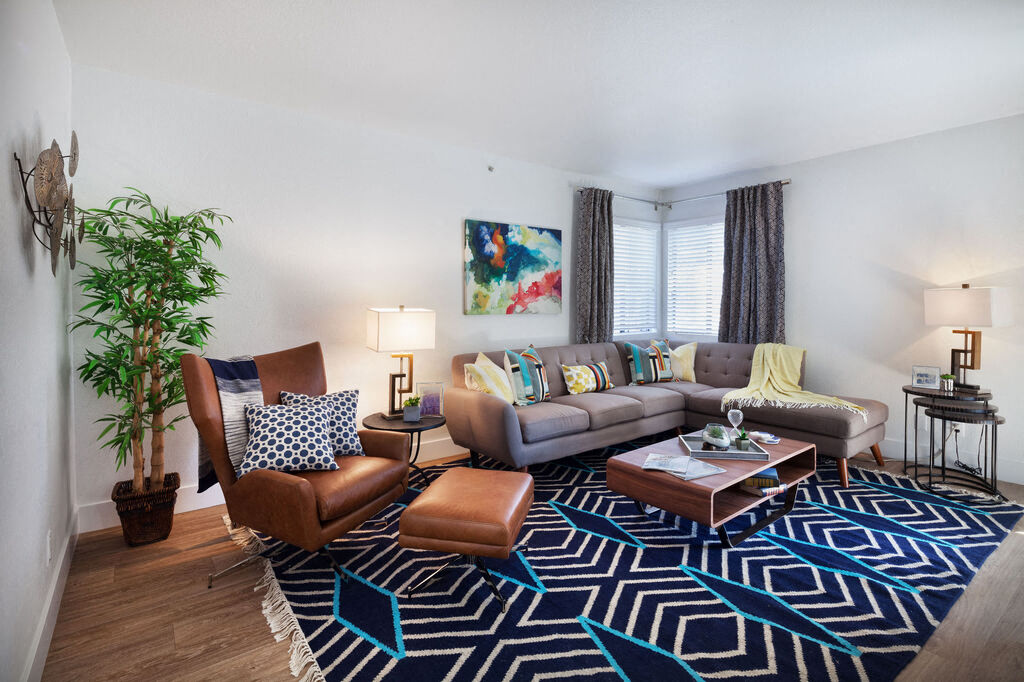 furnished living room with couches and chairs at the adelaideelaide apartments