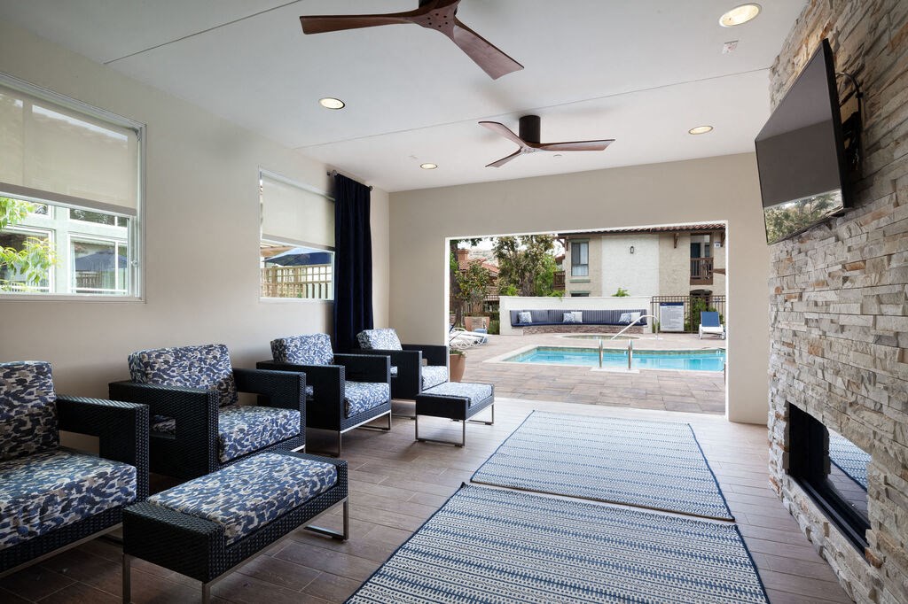 a living room with a fireplace and a poolat The Bryant, Yorba Linda, CA