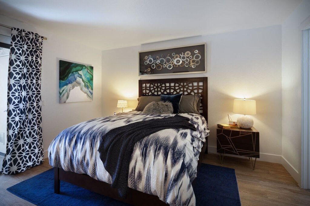 a bedroom with a bed and a blue rug at The Bryant, Yorba Linda, CA