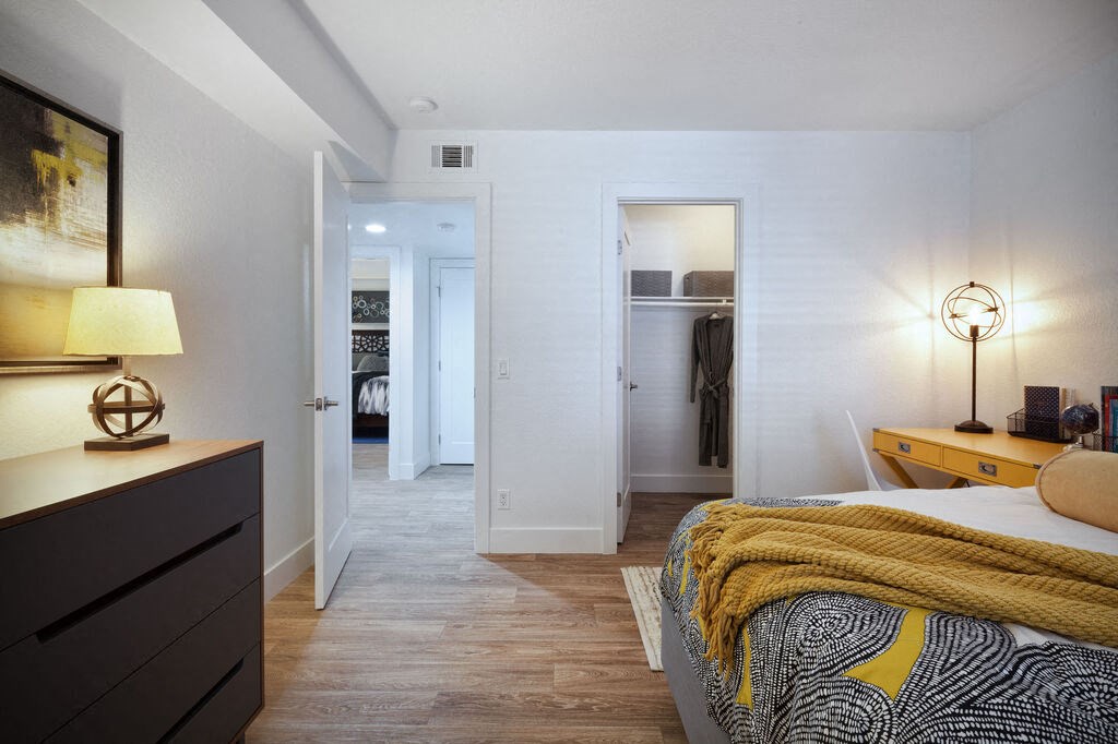 a bedroom with a bed and a closetat The Bryant, California